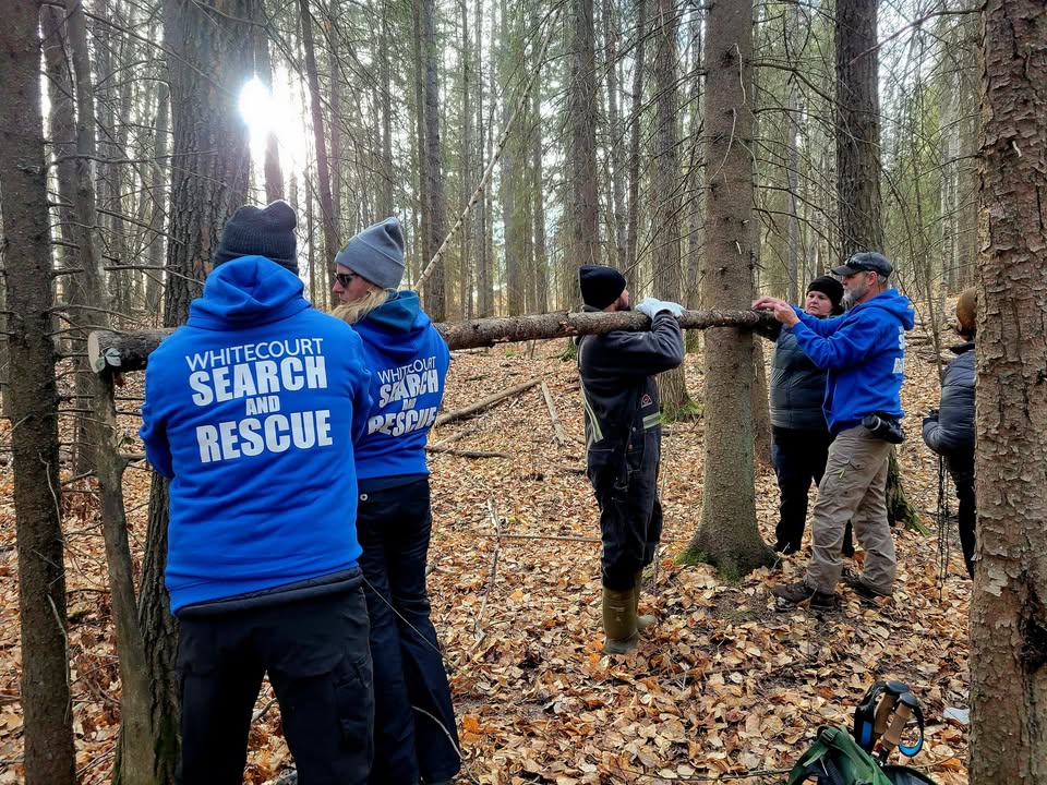 Whitecourt SAR members in the woods